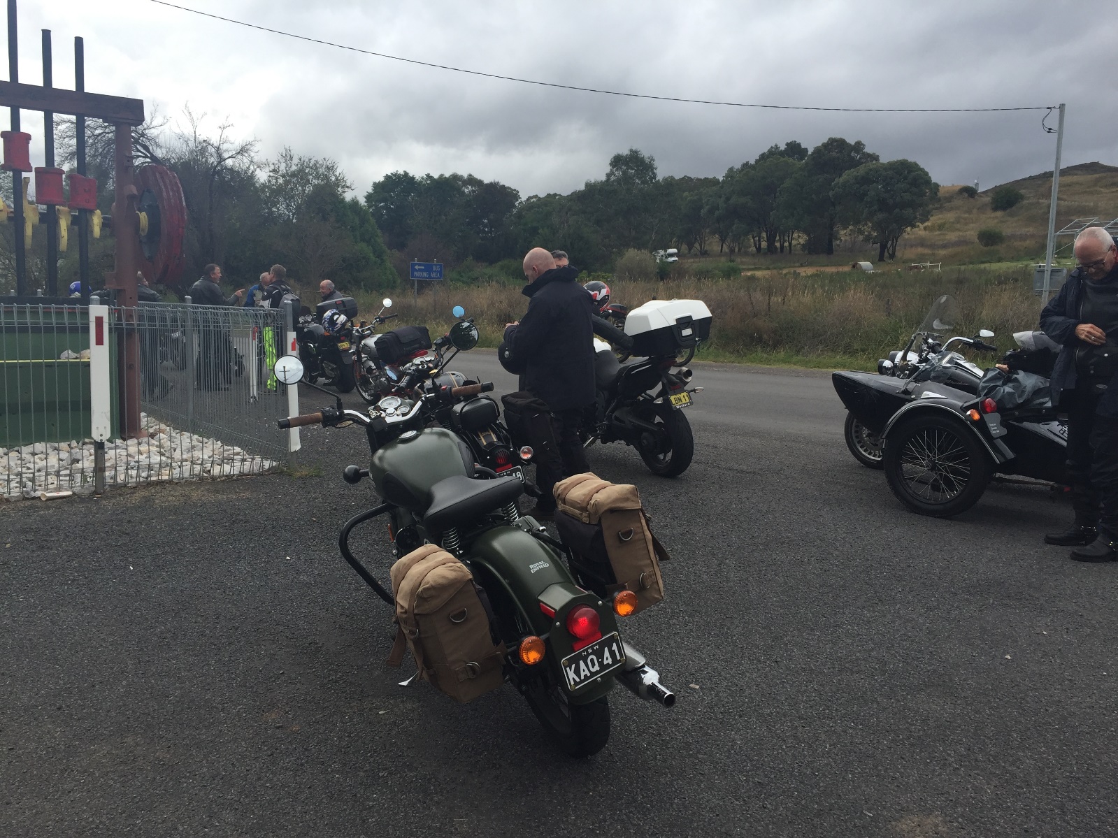 A group of motorcycles parked on the side of a road

Description automatically generated with low confidence