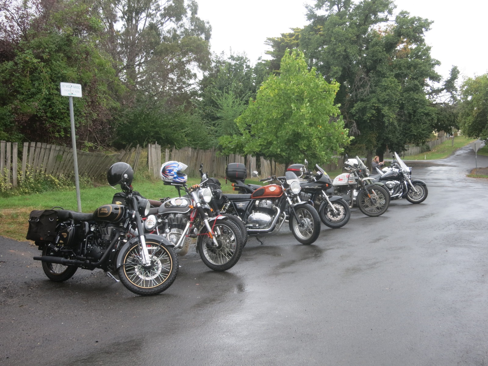A group of motorcycles parked on the side of a road

Description automatically generated with medium confidence