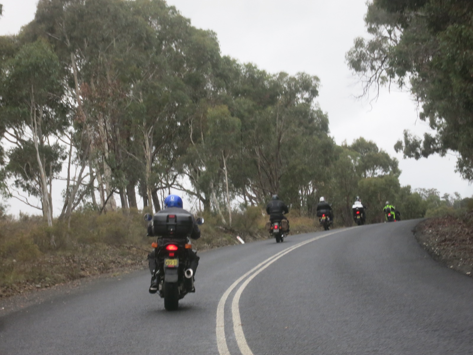 A group of motorcycles travel down a road

Description automatically generated with medium confidence