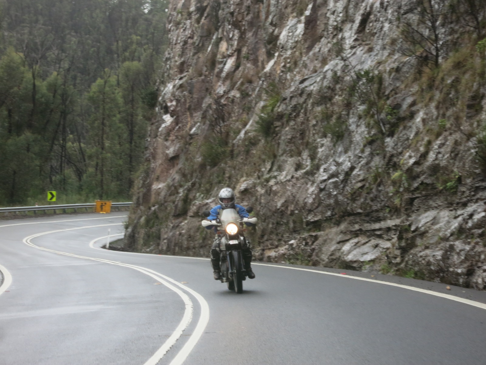 A person riding a motorcycle on a road

Description automatically generated with low confidence