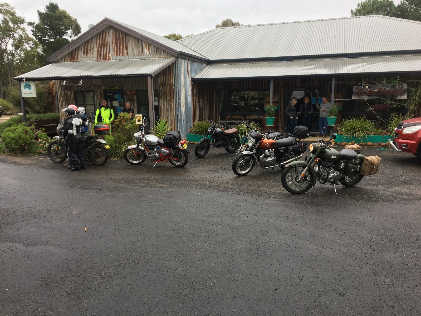 Motorcycles parked in front of a store

Description automatically generated with medium confidence