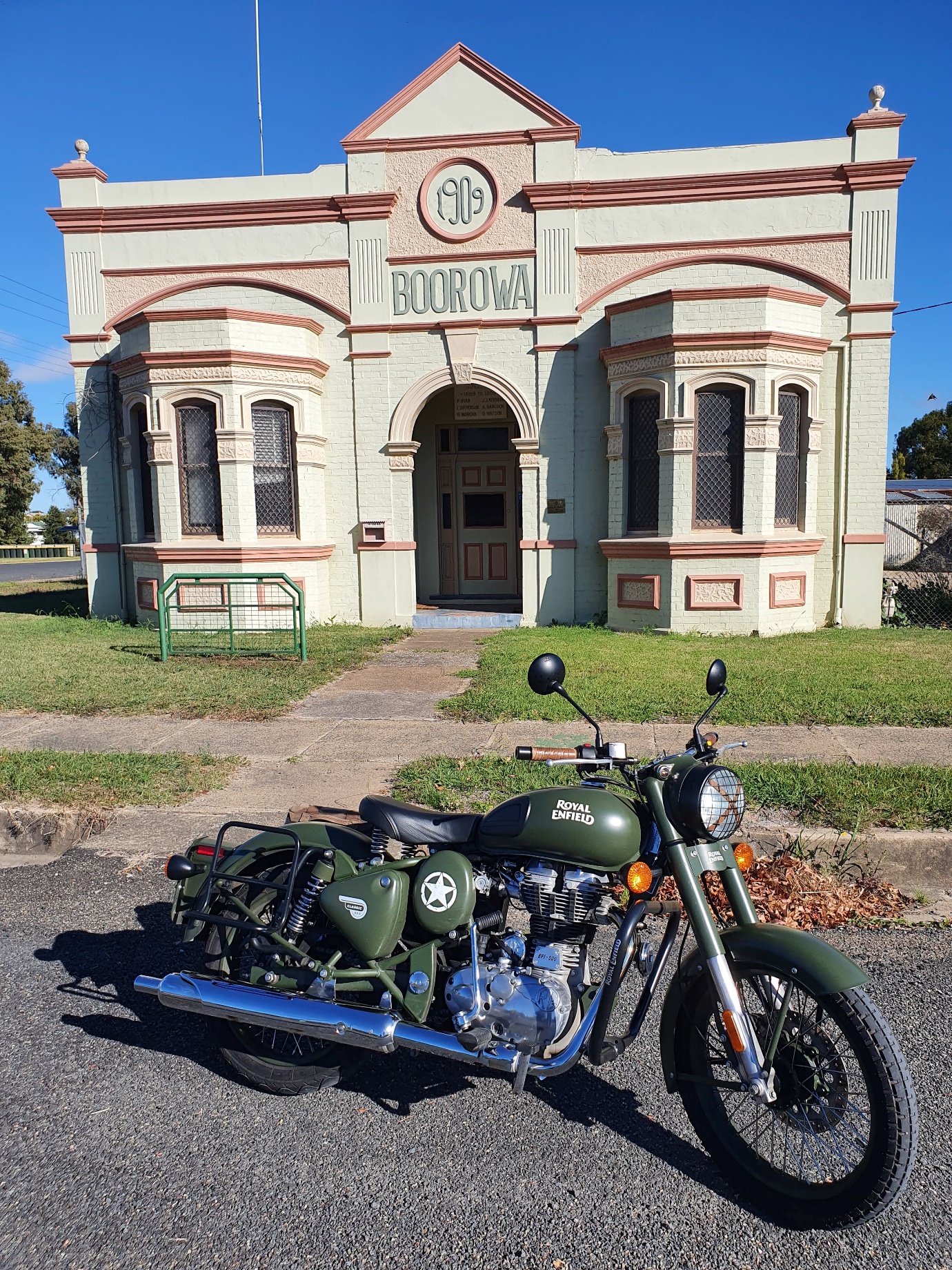 A motorcycle parked in front of a building

Description automatically generated with medium confidence