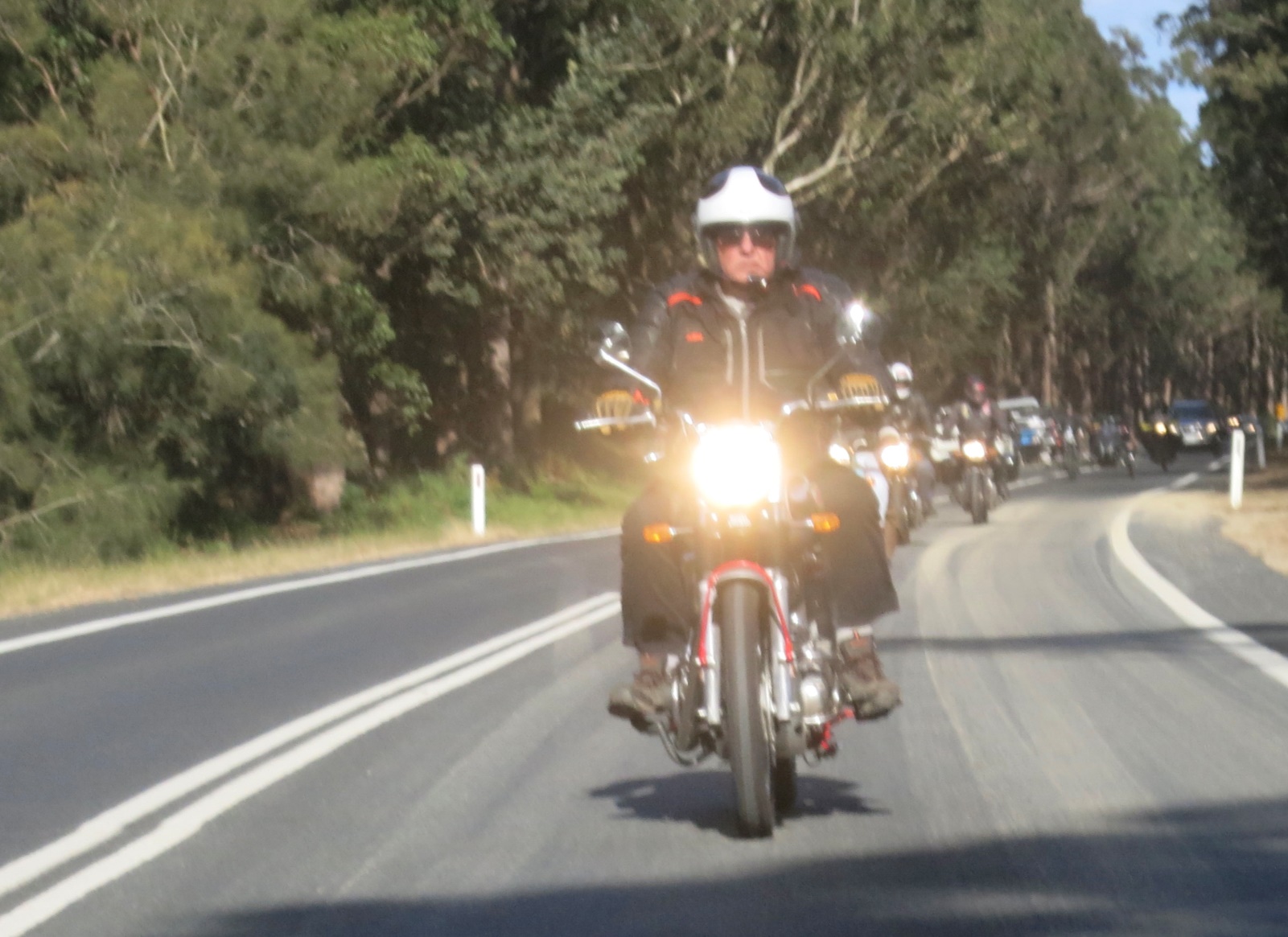 A person riding a motorcycle Description automatically generated with medium confidence