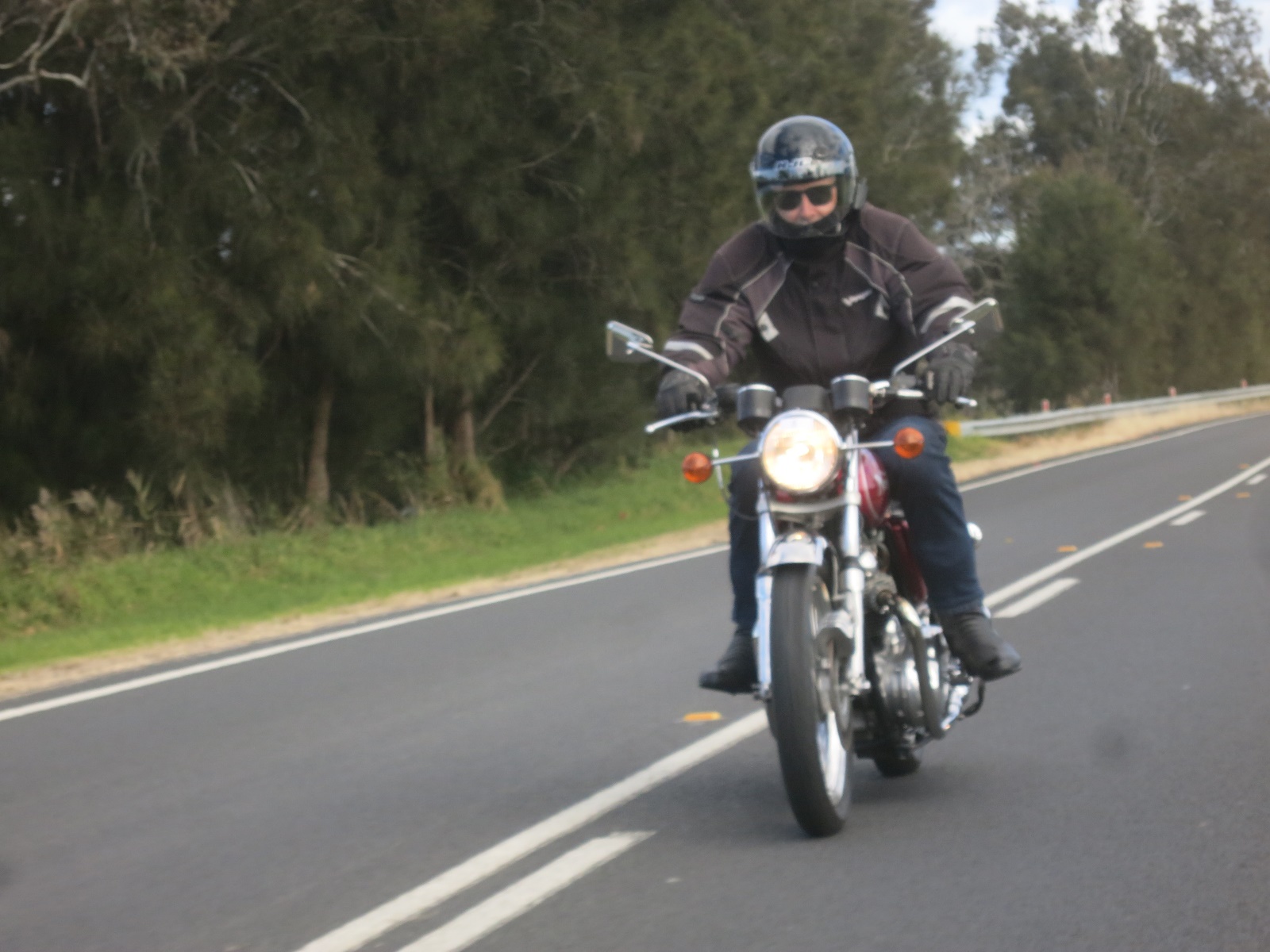 A person riding a motorcycle Description automatically generated with medium confidence