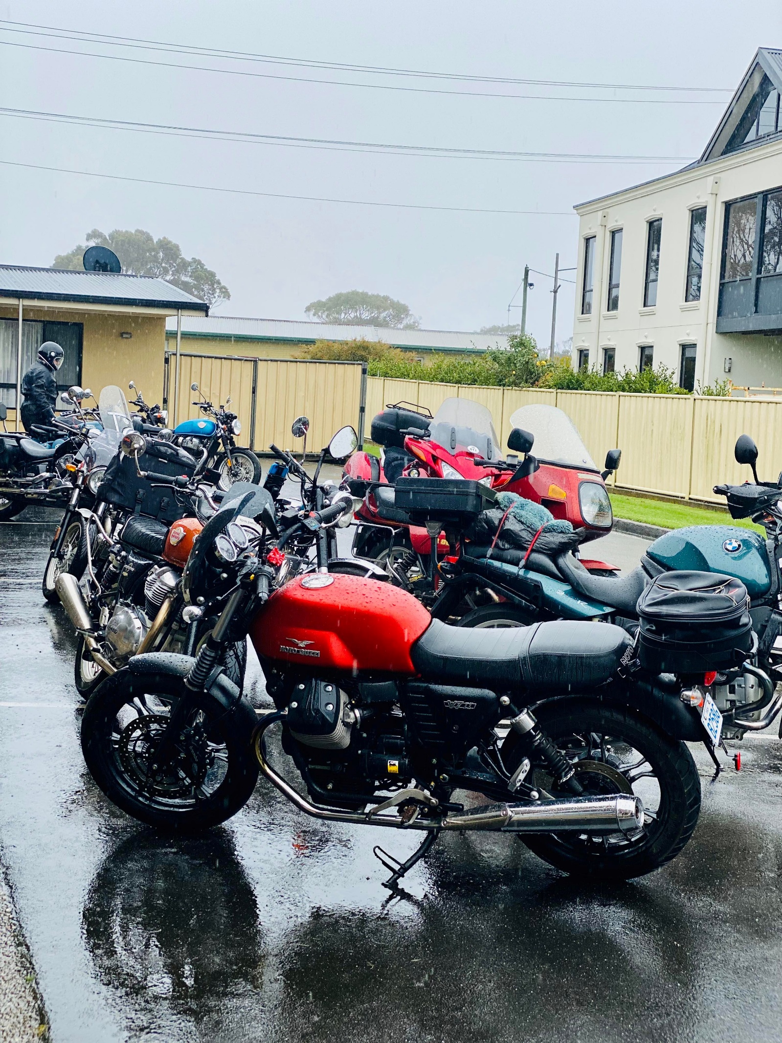 A group of motorcycles parked on the side of a road Description automatically generated with medium confidence