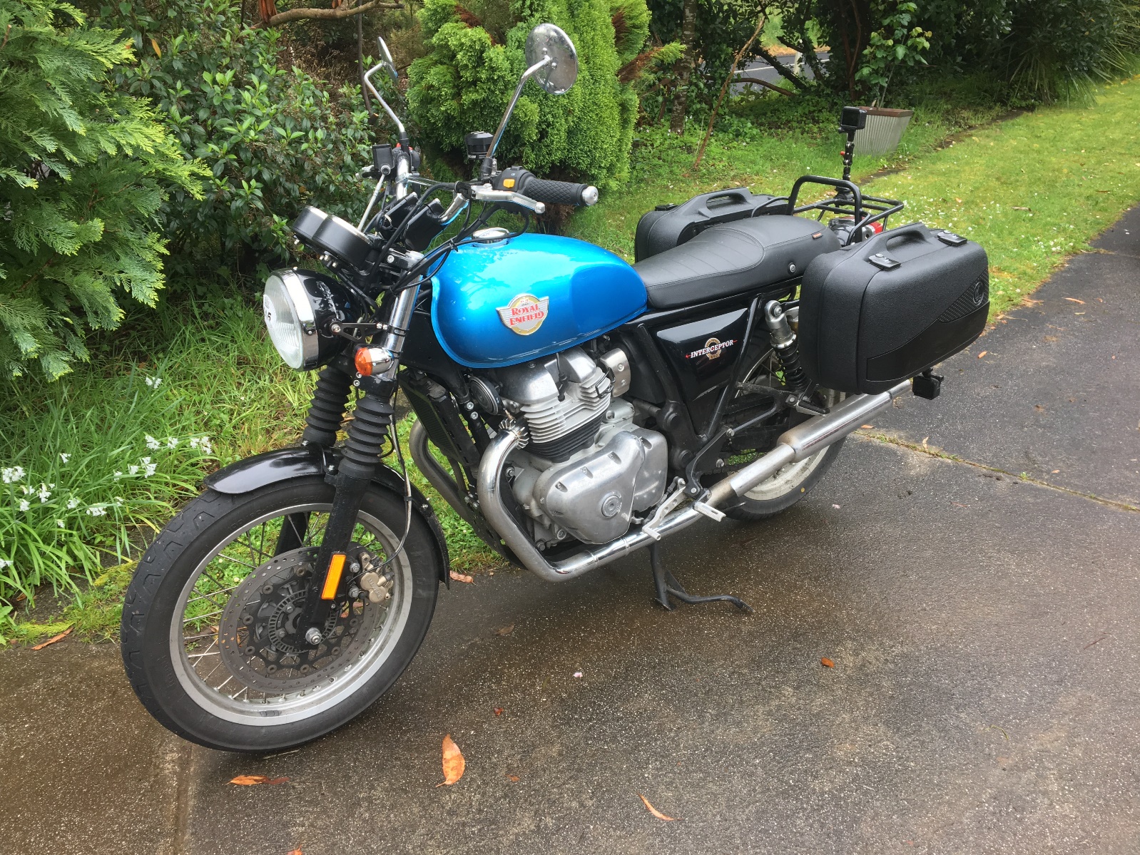 A motorcycle parked on the side of a road Description automatically generated with medium confidence